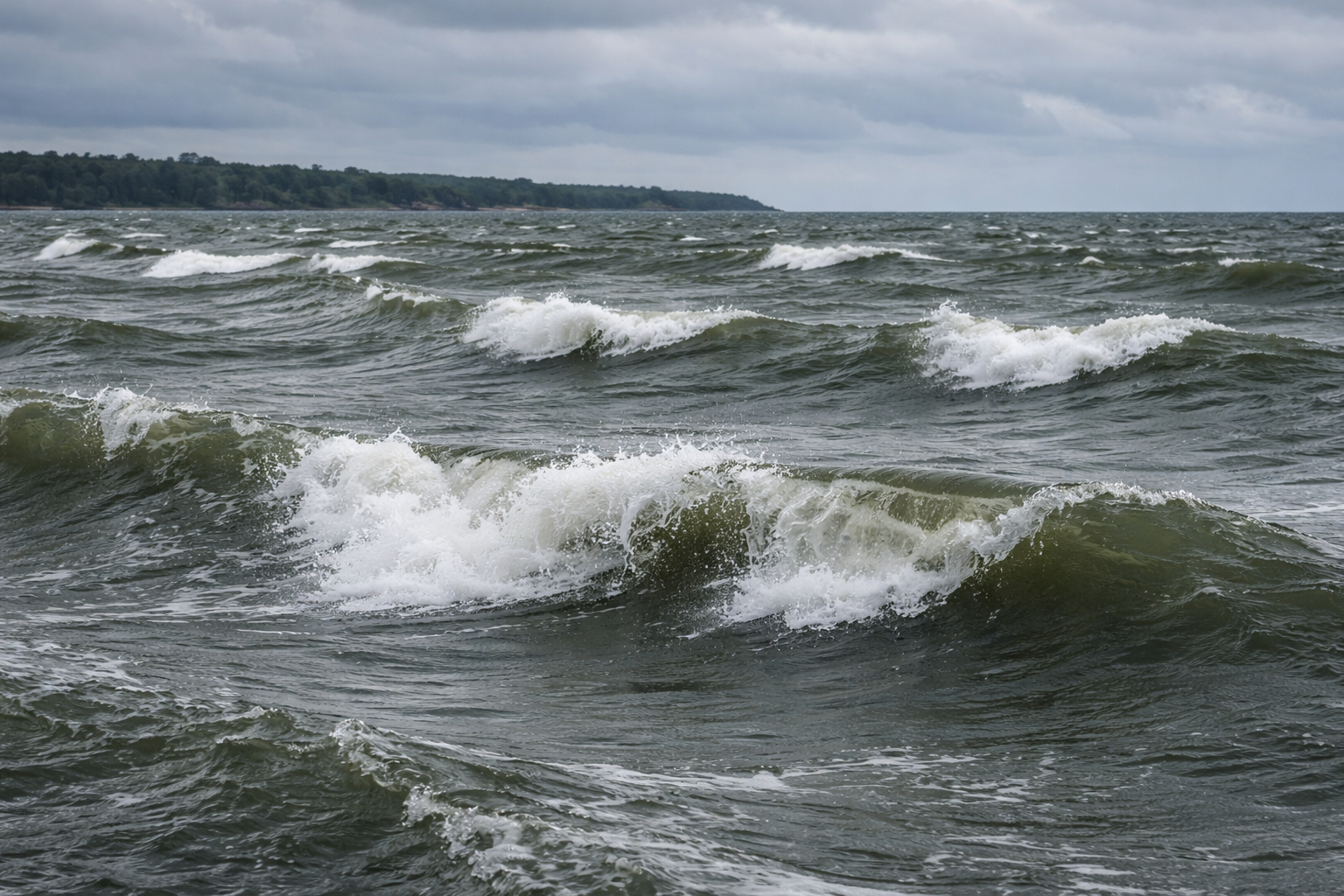 Dark, choppy Great Lakes water under a moody Ontario sky